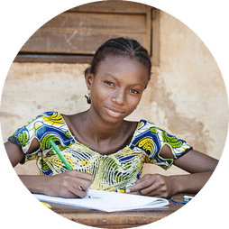 A young lady writing a note